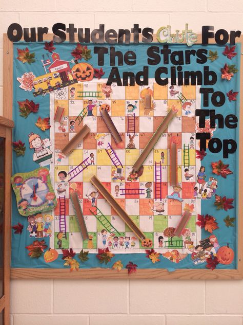 Chutes and Ladders bulletin board. Chutes And Ladders Bulletin Board, Game Themed Bulletin Boards, Board Game Bulletin Board Ideas, Chutes And Ladders Decorations, Employee Appreciation Board, Elementary School Bulletin Boards, Office Bulletin Boards, Board Game Themes, Interactive Bulletin Board