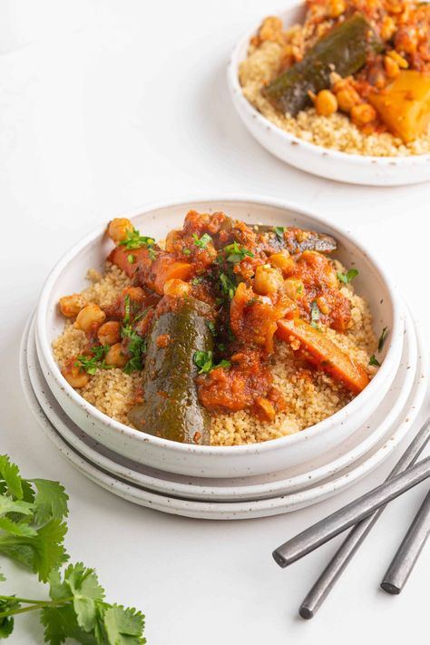 This authentic Moroccan couscous is a colorful dish made with perfectly cooked couscous topped with lamb, a variety of stewed veggies and a flavorful broth. My family in Morocco make it every Friday as a way to gather together and pray. Vegan Couscous Recipes, Couscous Dishes, Moroccan Chickpea, Moroccan Couscous, Couscous Recipes, Colorful Dishes, Lamb Shanks, Gather Together, Vegetable Stew