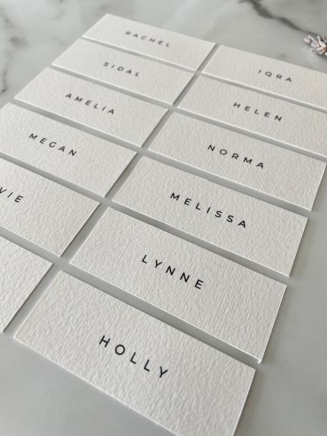 These minimalist style personalised place names are the perfect decor to complete your table scape. Whether planning your wedding day, or a classic event such as a dinner party, bridal shower or baby shower, these place names are perfect for you. Each individually designed then printed on premium textured 300gm2 card. D E T A I L S- Individually designed and printed on premium textured 300gm2 card- Finished size is 3cm x 7.4cm- Font as is unless required- Printed using true black ink- Posted via Royal Mail for safe and trusted deliveryIf you have any special requests just reach out! We love to hear from you and help to plan your personalised event. Simply message us with any further questions you may have. Follow us on social media! @withlove.el Wedding Name Place Cards Hand Written, Name Plates For Wedding Table Settings, Table Seating Names Place Settings, Name Card Design Wedding, Minimalist Wedding Place Settings, Wedding Table Place Settings Elegant, Simple Place Cards, Name Place Wedding, Name Card Table