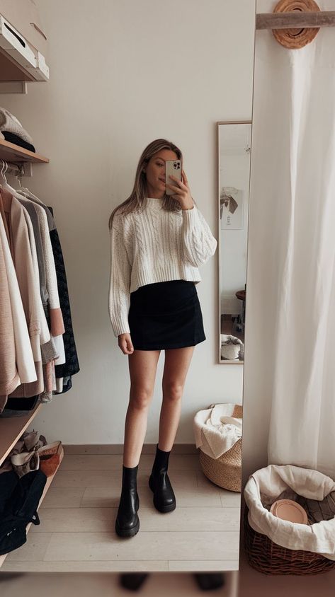 Black Mini Skirt Outfits That Slay Black Mini Skirt Outfit Date Night, Mini Skirt Fashion Classy, Check Mini Skirt Outfit Winter, Aritzia Black Mini Skirt, How To Style Short Skirt In Winter, White Sweater Black Skirt Outfit, Aritzia Pleated Skirt Outfit, Pleated Skirt Black Outfit, Mini Skirt Christmas Outfit