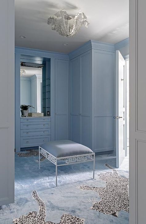 Blue walk-in closet with a striking animal print carpeting features blue built-ins, blue crown moldings and a blue Greek key bench. Blue Walk In Closet, Built In Dresser, Dressing Room Closet, Rice Paddy, Trending On Pinterest, Walk In Closets, Dream Closets, Bleu Pastel, Blue Rooms