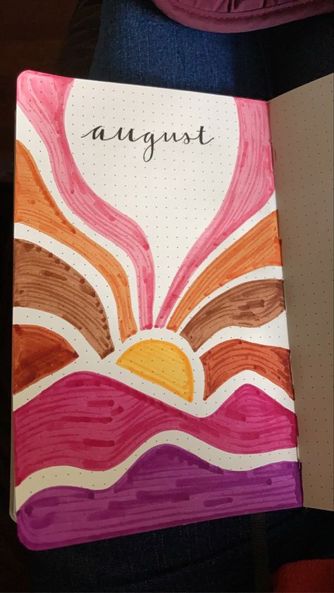 August Bullet Journal cover page. Title is “august” and is surrounded by a drawing of an alternative style of sunset over mountains. Mountains are pink and purple with the sun rays differing shades of brown. August Journal Ideas Aesthetic, Notebook Cover Painting Ideas Easy, Cute Journal Cover Design, Art Book Cover Ideas Drawing School, August Scrapbook Ideas, August Bullet Journal Cover Easy, Easy Aesthetic Drawings With Color, Pretty Journal Covers, Sunset Bullet Journal