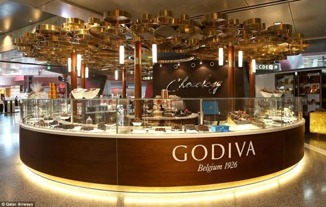 Chocolate Store Design, Luxury Airport, Hamad International Airport, Juice Bar Design, Chocolate Boutique, History Of Chocolate, Chocolate Stores, Coffee Shop Interior Design, Godiva Chocolate