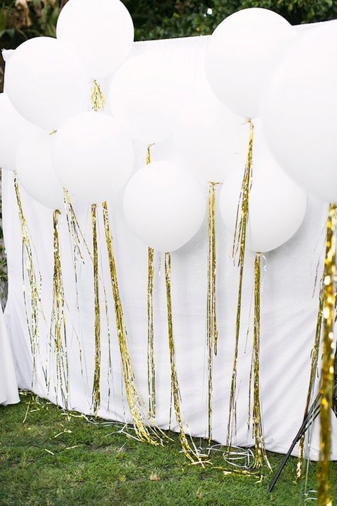 Bookmark this for 17 fun ideas to bring the balloon wall trend to your next party like a set of these golden tassel white balloons. Diy Fotokabine, White Party Theme, Photo Booth Backdrop Wedding, Booth Backdrops, Wedding Reception Backdrop, Photos Booth, Diy Photo Booth, Backdrop Ideas, Wedding Photo Booth