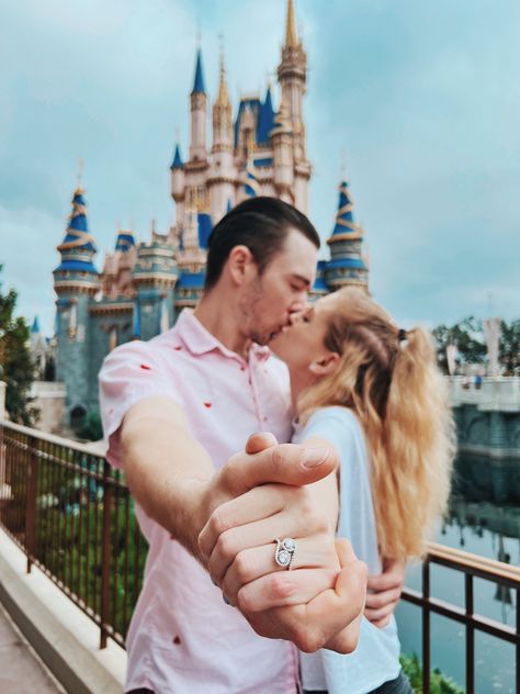 Abby and Dakota share a kiss infront of the Castle at Magic Kingdom in Walt Disney World. They are hugging, and holding hands, outstretching their front arms to show Abby’s new engagement ring. Cinderella Engagement Photos, Engagement Photos Disney, Disney World Engagement Pictures, Disney Couple Pictures, Disneyland Couples Pictures, Disney Engagement Pictures, Disneyland Engagement Photos, Disney Photoshoot, Prenup Shoot