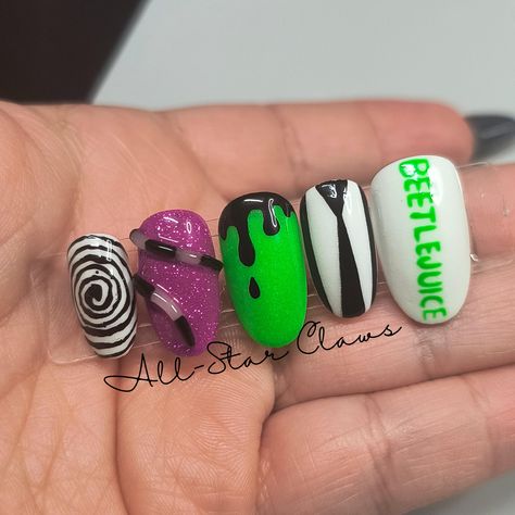 The thumb pointer and pinky nails have a white gel base colors with a glow in the dark powder. The thumb has hand painted "Beetlejuice" name, the pointer has his black and white suit and tie design and the pinky has a black swirl. The middle is a green also with glow powder and black drips. The ring is a purple reflective disco gel with a glow 3D snake. All nails have a glossy top coat finish. All nails have a builder gel layer. Available in different shapes and lengths. **Please measure your nails for the XXL length and select "XXL Custom Sizes" then send me your measurements.** Each order comes with a nail prep kit which includes nail glue, nail adhesive tabs, nail file, buffer, cuticle stick, alcohol wipes, and instructions. Please don't hesitate to ask me any questions. Beetle Juice Nails Designs, Beetlejuice Nails Short, Beetlejuice Nails Acrylic, Beetlejuice Nail Designs, Beetlejuice Nail Art, Beetle Juice Nails, Beetlejuice Nails, Glow In The Dark Nails, 3d Snake