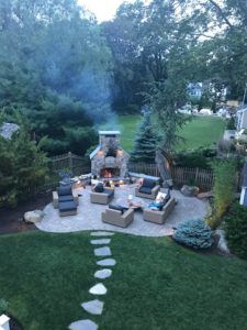 Backyard Patio Designs With Pizza Oven, Fireplace Area Outdoor, Outdoor Seating Area By Lake, Outdoor Patio With Fireplace Ideas, Flagstone Patio With Fireplace, Outdoor Living Space With Fireplace, Outdoor Fireplace Decorating Ideas, Fire Pit On A Hill, Outdoor Fireplace Area