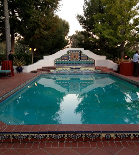 Colorful—love the shape of the back wall Spanish Revival Pool, Pool Detail, Spanish Pool, Homes With Pools, Tiled Pool, Spanish Hacienda, Pool Fountain, Mediterranean Home Decor, Luxury Pools