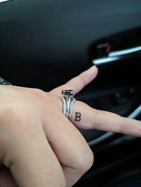 Initial Tattoo On Ring Finger, Husband Name Tattoos For Women, Tattoo On Ring Finger, Finger Letter Tattoos, Name Tattoos For Women, Letter D Tattoo, Husband Name Tattoos, Letter B Tattoo, Side Finger Tattoos