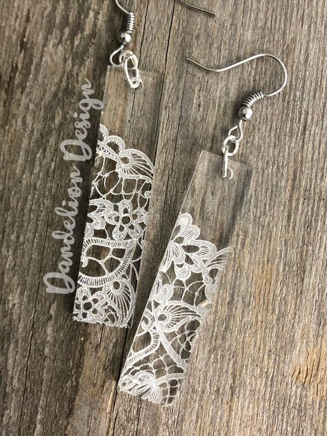 This listing is for a pair of lightweight clear acrylic laser cut handmade earrings. They are approximately 2 inches in length, engraved with an intricate lace pattern, and come in either teardrop or rectangle shape. Lead and Nickel free hardware, and come with clear back stoppers.    If you don't own a pair of these lightweight earrings, you are missing out! Each pair of earrings are cut in my shop and hand assembled by me! Various patterns, sizes and shapes are available for any style.  I love Cnc Earrings, Wood Laser Engraving Machine, Laser Cut Earrings Acrylics, Acrylic Earrings Laser Cut, Laser Products, Forge Ideas, Laser Cut Jewelry Acrylic, Cricut Earrings, Laser Crafts