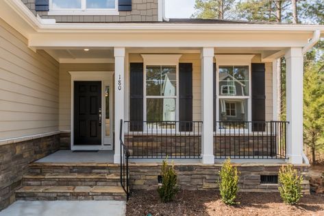 Updating Front Porch Columns, White House Black Porch Post, Front Porch Ideas Brick House, Front Porch Banisters And Railings, Black Front Porch Railing, Metal Porch Railing Ideas, Front Stairs Ideas Exterior, Porch Banister, Porch Skirting