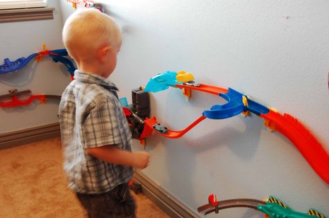 Hot Wheels Wall Tracks Review Hot Wheels Track Organization, Hot Wheel Race Track Storage, How To Store Hot Wheels Tracks, Hot Wheels Track Storage, Hot Wheels Track Diy, Monster Truck Themed Bedroom, Matchbox Storage, Monster Truck Bedroom, Hot Wheels Race Track