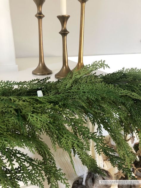 How to attach garland to a fireplace mantel (Sunny Side Up) Cypress Garland Mantle, Greenery On Mantle, Christmas Mantles Ideas Fireplaces, Garland Fireplace Mantle, Mantle Greenery, Mantle Christmas Decor Ideas, Garland On Mantle, How To Hang Garland On Mantel, Christmas Sheets