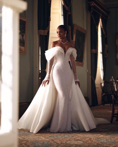 ALONUKO BRIDAL on Instagram: "OPU-08 | The gown is adorned with elegant beading, featuring a plunge neckline and expertly crafted off-shoulder draping. Adding a contemporary touch, the detachable beaded point-edge sleeves provide a modern edge.  #alonukobridesdoitbest" Glam Wedding Dress, Classy Wedding Dress, Afrikaanse Mode, Stylish Wedding Dresses, Fancy Wedding Dresses, Womens Wedding Dresses, White Wedding Dress, Fancy Wedding, Dream Wedding Ideas Dresses