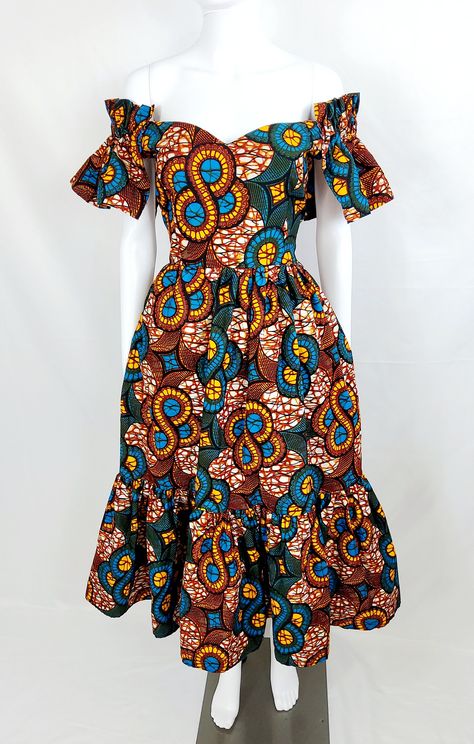 This stunning African Print Women midi Dress is a must-have for anyone looking to add some style to their wardrobe. The dress boasts a beautiful geometric pattern and features an off-the-shoulder neckline and Ruffles sleeves for a chic touch. The zipper closure adds convenience, while the ruffle accents give it a playful flair. Perfect for any occasion, this dress is suitable for travel, weddings, holy communions, parties, and casual wear. It's made from a soft and comfortable blend of polyester Off Shoulder African Dress, Chitenje Dresses For Women, Ankara Dress For Women, Chitenje Styles For Women, Offshoulder Ankara Dress With Elastic, Ankara Flair Dress Styles, Flair Dresses African, African Wear Dresses For Wedding, Wax Style African Fashion