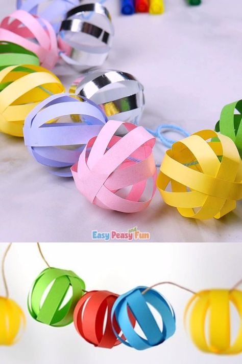 This paper ball garland craft is perfect as a Christmas decoration and it will also look absolutely adorable at any birthday party (any time of the year). Garland Craft, Paper Ball, Christmas Decorations For Kids, Paper Balls, Seni Dan Kraf, Ball Garland, Kraf Diy, Hiasan Bilik, Christmas Paper Crafts