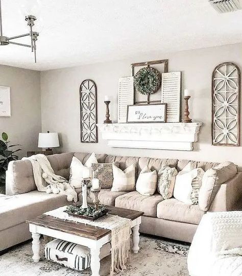 a chic neutral farmhouse living room with a tan sectional, a shelf with shutters and wooden candlesticks, a low coffee table Cozy Farmhouse Living Room, Modern Farmhouse Living Room Decor, Серая Кухня, Farmhouse Living Room Decor Ideas, Rustic Farmhouse Living Room, Farmhouse Living Room Decor, Living Room Wall Decor Ideas, Room Wall Decor Ideas, Modern Farmhouse Living