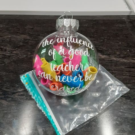 Hand Crafted Custom Made To Order Silver Top With Push Pronged Closure Multi Colored Erasers Fill The Ornament Bulb Saying "The Influence Of A Good Teacher Can Never Be Erased" Homemade Ornament For Teacher, Teacher Christmas Survival Kit, Arts And Crafts Christmas Gifts, Diy Teacher Christmas Ornaments, Teacher Ornaments Cricut, Affordable Teacher Christmas Gifts, Teacher Ornament Ideas, Teacher Christmas Gifts Diy, Teacher Ornaments Diy