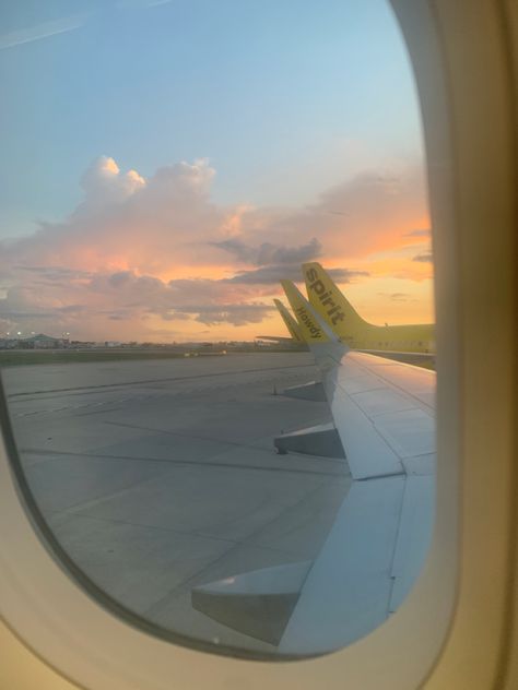 Photo of sunset out of plane window on ground, another spirit airlines plane in view Flying First Class Aesthetic, Flights Aesthetics, Japan Flight Aesthetic, Travel Aesthetic First Class Plane, Airplane Landing, Spirit Airlines, Night Flight, Future Jobs, Airlines