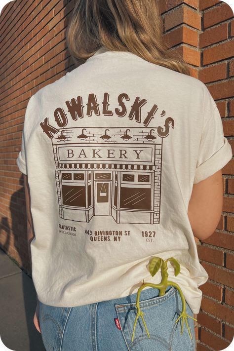 Cozy up in our BAKERY crewneck sweatshirt. This soft, oversized sweatshirt is perfect for lounging around or running errands. #bakery #sweatshirt . #Hippies #Cute_Work_Shirts_With_Logo #Concert_T-shirt_Design #T_Shirt_Font_Design Cute Work Shirts With Logo, Logo Tshirt Outfits, T Shirt Font Design, Restaurant Tee Shirt Design, Bakery T Shirt Design, Cafe T Shirt Design, Business T Shirt Design, Work T Shirt Design Ideas, Restaurant Tshirt Designs