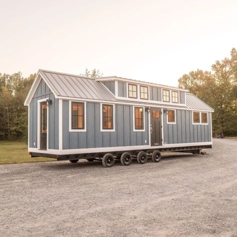 New Beachy Teton by Timbercraft Tiny Homes Tiny Home Beach House, Bedroom With Lots Of Storage, Tiny House By The Sea, Tiny Seaside Cottage, Mini Beach House Tiny Homes, Timbercraft Tiny Homes, Tiny Houses On Wheels, Bedroom Ceilings, Two Loft Tiny House On Wheels