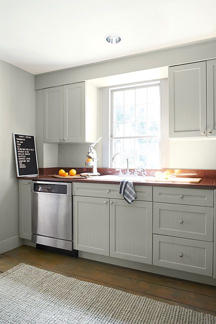 Best Greige Paint Colors - Benjamin Moore's Titanium OC-49. Via @benjamin_moore Kitchen Benjamin Moore, Soffit Lighting, Best Greige Paint Color, Blue Rocking Chair, Benjamin Moore Kitchen, Grey Painted Kitchen, Sink Dishwasher, Kitchen Soffit, Greige Kitchen