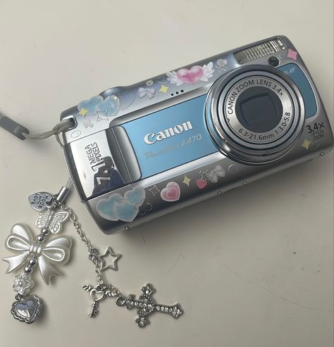 canon a470 #deco #digitalcamera #camera #cute Digital Camera Charm Strap, Digital Camera Deco, Blue Digital Camera, Blue Camera Aesthetic, Kodak Camera Aesthetic, Digital Camera Decorated, Decorated Camera, Vintage Camera Aesthetic, Amazon Camera