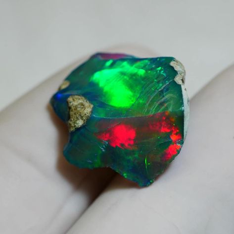 7.55Ct, Smoked Opal Rough, Ethiopian Black Opal Rough, AAA+ Grade Black Opal Raw, Rainbow Welo Fire Opal Rough for Jewelry grade, Opal Raw. (BR 32) Welcome to Our Shop  Stone Name :- Smoked Ethiopian Opal Rough Stone Weight :- 7.55 CTS Stone Type :- RAW (BR 32) Opal Benefits : This gemstone provides Neuro-stability to its wearer as it creates a balance in between the left and right hemispheres of the brain. Wearer of an Opal gets benefits from it as it cures several problems related to eye, throat, spleen, bone marrow, pancreas and reproductive organs. Opal has a long history of being used by people as a good luck charm to bring happiness, wealth, and health into their lives. Opals come in a wide variety, with white opal being recognized as a health-healing stone. Opal can be used to effec