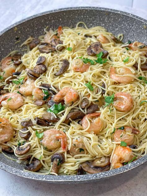 Mushrooms, onions, garlic, shrimp, and pasta come together with some cilantro garnish to make an amazing wine-free and easy shrimp scampi that is delicious Cilantro Shrimp, Shrimp And Pasta, Shrimp Scampi Pasta, Easy Shrimp Scampi, Fancy Dishes, Shrimp Scampi Recipe, Traditional Italian Dishes, Scampi Recipe, Drink Inspiration