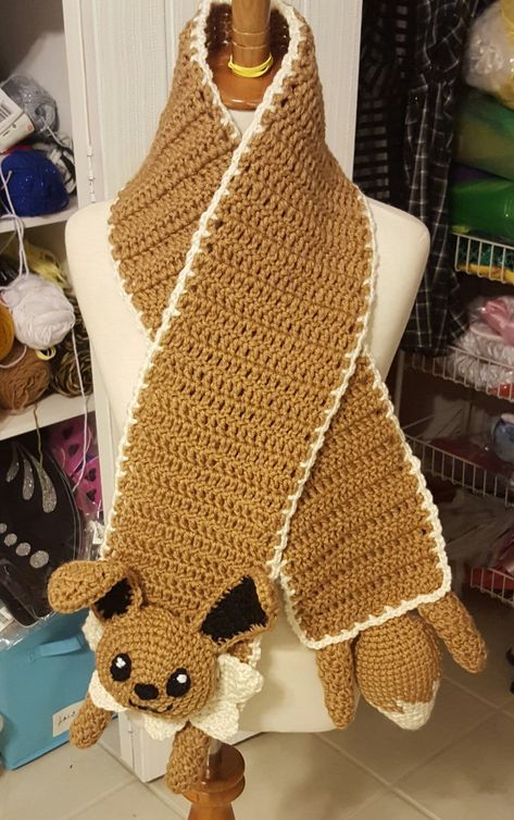 Eevee crochet scarf I made Eevee Pokemon Crochet Pattern, Eeveelutions Crochet, Pokemon Scarf Crochet Pattern, Eevee Crochet, Crochet Pokemon Scarf, Eevee Crochet Hat, Crochet Jolteon, Pokemon Scarf, Pokemon Halloween