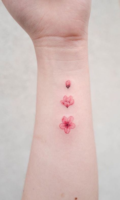 Sakura Petal Tattoo, Cute Tattoos Red Ink, Sakura Small Tattoo, Pink Color Tattoo, Pink Small Tattoos, Blossoming Flower Tattoo, Small Pink Tattoo, Hibiscus Tattoo Red, Pink And Red Tattoo