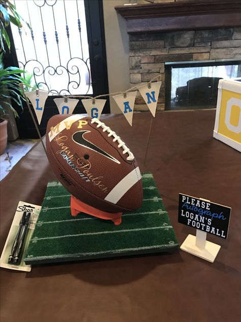 Football Gift Wrapping Ideas, Football Centerpiece Ideas Dollar Stores, Dallas Cowboys Balloon Centerpieces, Cowboys Birthday Party Football, Football Lantern Centerpieces, Football Baby Shower Games, Football Baby Shower Theme, Dallas Cowboys Baby Shower, Notre Dame Baby