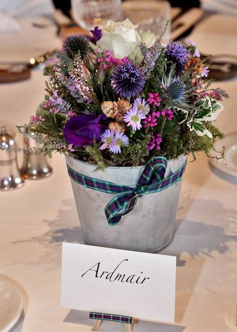 Highland wedding table decorations Scottish Flowers Wedding, Heather Table Decorations, Tartan Wedding Decorations, Scottish Party, Summer Wedding Flowers Centerpieces, Scottish Flowers, Tartan Wedding, Rosie Posie, Highland Wedding