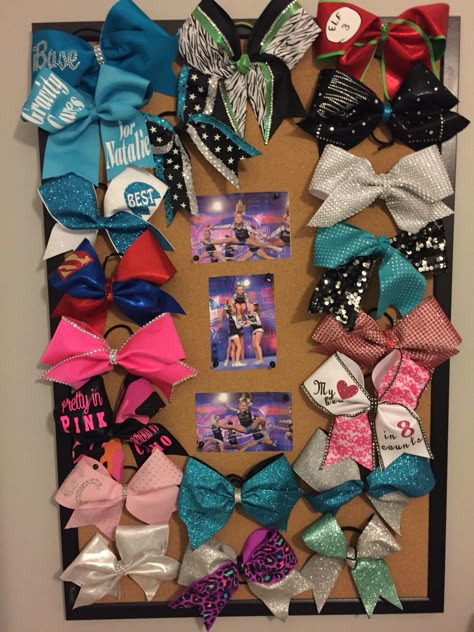 Cheer bow display cork board cheerleading bows Cheer Bows Display Ideas, Cheer Ribbon Display, Cheerleading Room Decor, Cheer Bow Display Graduation, Cheer Bow Display Ideas, Cheer Bow Storage Ideas, Cheerleading Room Ideas, Cheer Display Ideas, Cheer Room Ideas Bedrooms