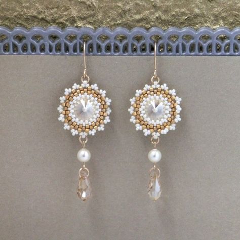 "I created this champagne drop earrings by hand, using Swarovski Rivoli 12mm, Swarovski pearls 5mm, Miyuki round seed beads, Miyuki Delica beads, and 14k goldfilled ear-wire * Measurements: Earring length: 2.36\" (6cm) Pendant diameter: 0.78\" (2cm) * The earrings will come beautifully packaged for a gift. * For other Bridal earrings: https://www.etsy.com/ca/shop/LioraBJewelry?ref=listing-shop2-all-items-count%C2%A7ion_id&section_id=16552834 * my shop: https://www.etsy.com/shop/LioraBJewelry