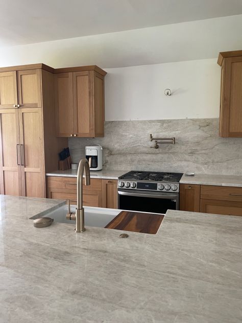 White Brown Countertops, Quartz Countertops With Light Wood Cabinets, Cherry Oak Cabinets Kitchen, Uneven Kitchen Cabinets, Quartz Countertops With Maple Cabinets, Leather Quartzite Countertops, Kitchen With Taj Mahal Countertops, Taj Mahal Quartzite Countertops Walnut Cabinets, Tan Mahal Countertop