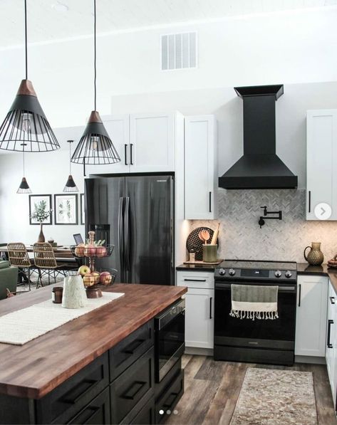 White Cabinets Black Island Butcher Block, Black And White Industrial Kitchen, Black Appliance Kitchen Ideas, Black Cabinets Kitchen Butcher Block, Modern Western Kitchen, Moving New House, Kitchen Butcher Block, Modern Industrial Kitchen, White Wood Kitchens