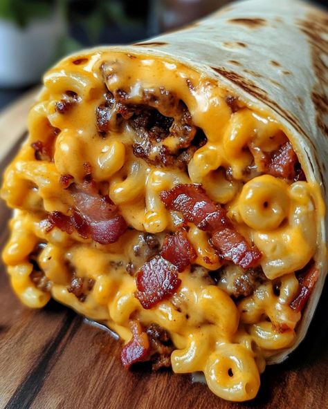 Satisfy your cravings with a Bacon Macaroni Cheeseburger Wrap! This delicious creation combines savory ground beef, perfectly cooked macaroni, crispy bacon, and gooey cheddar cheese, all wrapped up in a soft flour tortilla. A touch of ketchup and mustard adds the classic cheeseburger flavor. Easy to make and utterly satisfying, it's a fun twist on two comfort food favorites. Mac And Cheese Burrito, Cheeseburger Wrap, Cheeseburger Wraps, Cheese Burrito, Ultimate Mac And Cheese, Cottage Cheese Breakfast, Ketchup And Mustard, Salad Inspiration, Lactation Recipes