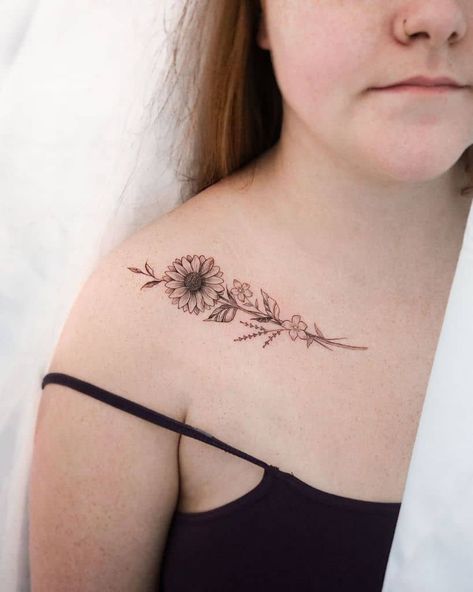 57 Small Sunflower Tattoo Ideas [2023 Inspiration Guide] Sunflower Clavicle Tattoo, Sunflower Tattoo Collar Bone, Small Sunflower Tattoo, Tank Tattoo, Sunflower Tattoo Ideas, Wrap Around Wrist Tattoos, Clavicle Tattoo, Bone Tattoo, Cursive Tattoos