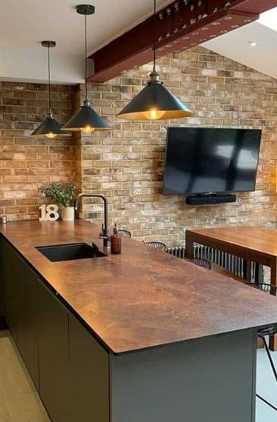 23 Kitchen & Bar Copper Countertop Design Ideas | Sebring Design Build Copper Kitchen Work Surface, Bronze Countertops Kitchen, Copper Kitchen Benchtop, Copper Painted Countertops, Copper Wrapped Kitchen Island, Bar Countertops Ideas, Rust Kitchen Countertops, Green And Copper Kitchen Ideas, Charcoal And Copper Kitchen