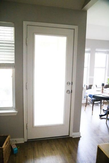 The back wall of our house has always been pretty dull. We recently gave our back door a makeover with a quick coat of paint, and it makes an incredible difference! Here are some quick tips on painting exterior doors - if you love this project, you can see more easy and affordable DIY ideas on my blog, Love & Renovations. Here's the before - our door wasn't in terrible shape, just boring! We decided to paint both the interior and the exterior of this door black - we wanted a high-co… Painting Exterior Doors, Exterior Kitchen Doors, Beach House Entryway, Door Refresh, Door Stopper Diy, Single Patio Door, Backyard Door, Exterior Bathroom, Painted Exterior Doors