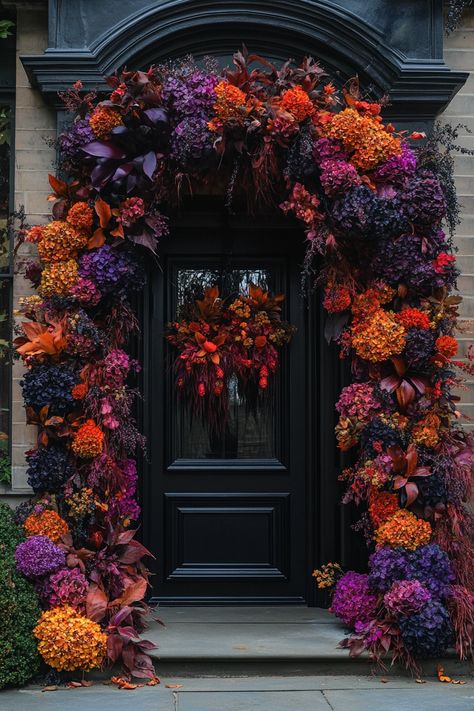 Ditch the Orange: Fresh Fall Front Door Garland Ideas – A Sparkly Life for Me Purple Orange Halloween Decor, Fall Porch Purple Mums, Red And Orange Garden, Halloween Porch Garland, Goth Porch, Halloween Door Garland, Purple Fall Decor, Purple Front Door, Purple Mums