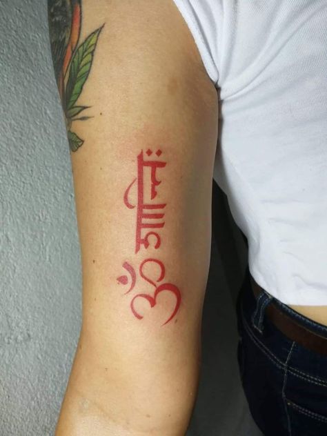 Red Ink tattoo of the buddhism symbol and the phrase “Om Mani” Red Ink Arm Tattoos, Om Shanti Tattoo, Shanti Tattoo, Red Ink Tattoos On Black People, Red Neck Tattoos, Tattooing Inks, Red Ink Tattoo, Girl Neck Tattoos, Hand Tattoos For Girls