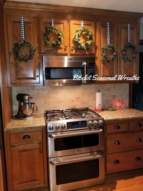 Brown Cabinet Christmas Decor, Kitchen Cabinet Wreaths, Cabinet Wreaths, Ramadan Celebration, Brown Kitchen Cabinets, Holiday Room, Brown Cabinets, Oak Kitchen Cabinets, Brown Kitchens