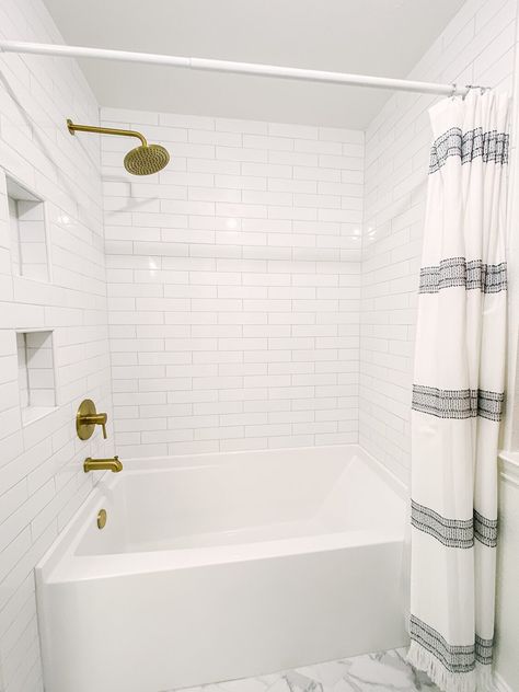 Bathtub White Subway Tile, Artisan Frost Ceramic Tile Bathroom, White Subway Tile Tub Shower Combo, Bath Shower Combo Tile Ideas, Simple Bathroom Remodel With Tub Shower Combo, 4x12 Subway Tile Bathroom Showers, White Subway Tile Tub Surround, White Subway Tile Bathroom Tub, Subway Tile Bathroom Tub