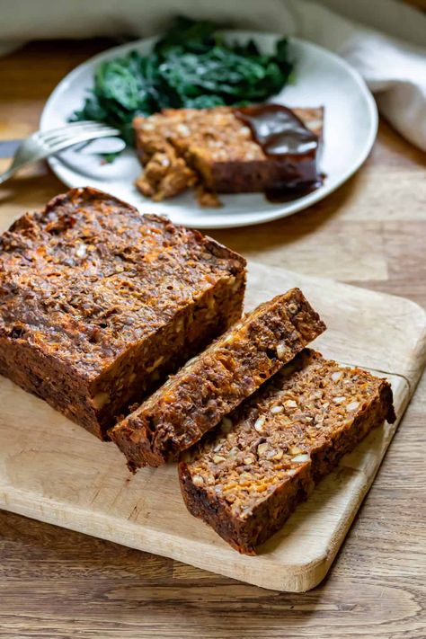 This easy Nut Roast is a delicious and hearty vegetarian or vegan main to serve at your next holiday gathering! The lentil and nut loaf is a meat-free meatloaf that's full of flavors and textures. You'll love serving it sliced with gravy. Vegetarian Loaf, Vegetarian Nut Roast, Lentil Loaf Vegan, Lentil Loaf Recipe, Vegan Nut Roast, Roasted Nuts Recipe, Veggie Desserts, Vegan Loaf, Nut Roast