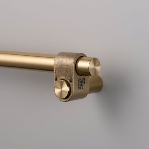 This Cast Cabinet Pull features a solid construction that is expertly finished and showcases a distinctive rough-cast knuckle and meticulously hand-polished solid metal bar. The casting process ensures each knuckle is uniquely formed, making every piece one-of-a-kind. It is suitable for a variety of interior spaces, including bathrooms. Hand tighten with a screwdriver. Power tools may strip the screws. Clean only with mild dish soap diluted in warm water. Cleaning chemicals may damage the finish Hardware Tape, Shower Door Handles, Furniture Hinges, Buster Punch, Cabinet Detailing, Brass Detail, Pull Bar, Cabinet Latch, Cookbook Holder