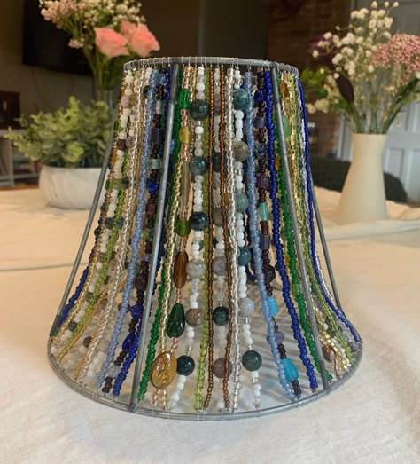 Each lampshade is meticulously hand beaded by yours truly :) Made with great care and attention to detail, this lampshade will be a unique addition to any room in your home or office! This lampshade includes Indian and marine agate gemstones, strung on sturdy beading wire! It also features glass beads to compliment the gemstones, the colors featured are in shades of blue, green, gold and white. This lampshade took me over a month to make! It can take days or weeks to source the perfect lampshade Colored Wire Crafts, Beaded Lampshade Diy, Diy Lamp Shade Makeover, Beaded Lamp Shade, Witchy Bedroom, Beaded Lampshade, Beaded Lamps, Lampshade Makeover, Diy Lampe