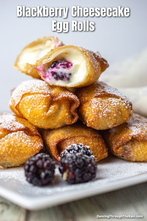 A pile of five Blackberry Cheesecake Egg Rolls on a white square plate with one cut open so you can see soft cheesecake filling and a blackberry Fruit Filled Egg Rolls, Sweet Spring Rolls Desserts, Fruit Filled Eggrolls, Cheesecake Spring Rolls, Desert Spring Rolls, Egg Roll Wrapper Desserts, Sweet Egg Rolls Desserts, Dessert Spring Rolls, Blackberry Truffles