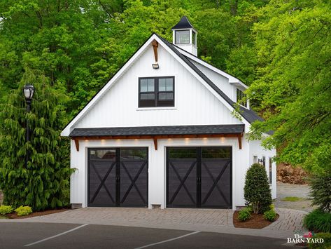 This 24' x 24' Newport Garage, on display at our Bethel location, has the coveted farmhouse feeling. Board & batten siding, black doors, windows, and accents, and a timber frame eyebrow roof create a rustic and refined appearance. This garage is available in New England only at a special package price of $89,700. Shown with options. 
.
#thebarnyard #customgarage #customgarages #newport #newportgarage #timberframeaccents #twocargarage #boardandbatten#farmhouse #garage #twostorygarage Eyebrow Roof, Barn Pool House, Post And Beam Cabin, Painted Garage, Two Story Garage, Barn Pool, House Columns, Timber Frame Pavilion, Single Garage